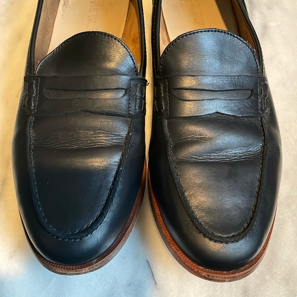 Black leather penny loafers